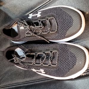 A pair of womens Under Armour shoes